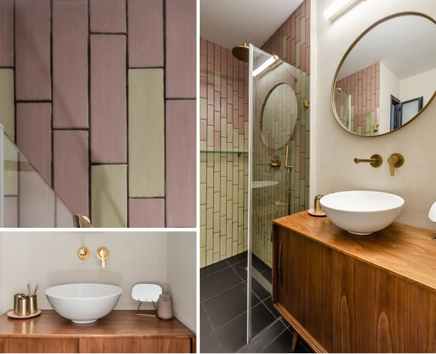 חדר אמבטיה בסוויטת הורים עם שידת עץ בסגנון וינטאג' ושימוש יצירתי באריחי בריק בגווני ורוד וירוק